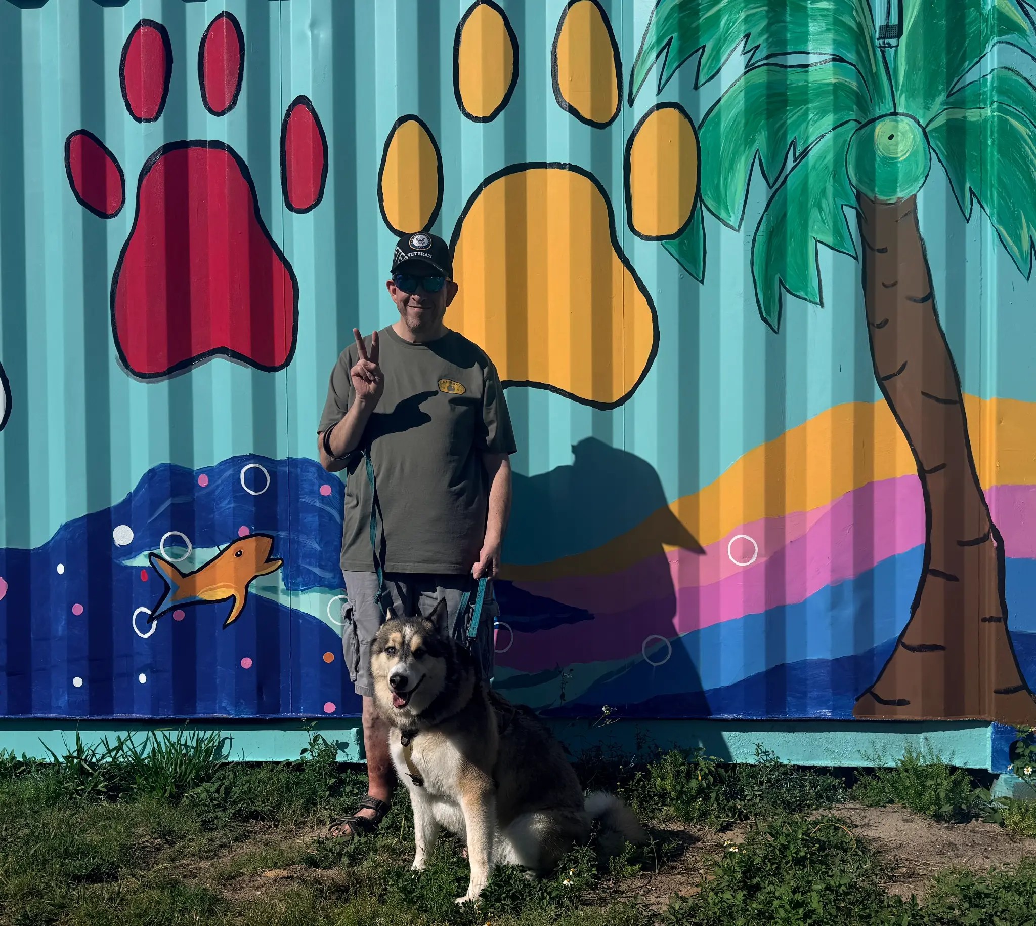 Mural of large breed dog and veteran at Da Vinci Unleashed